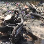 Scene of Diwali onion bomb explosion in Eluru, Andhra Pradesh, with damaged two-wheeler and surrounding area