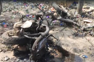 Scene of Diwali onion bomb explosion in Eluru, Andhra Pradesh, with damaged two-wheeler and surrounding area