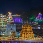 A serene view of the Tirumala temple surrounded by colourfull lighting