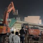 Collapsed building in Bhadrachalam with rescue teams on-site