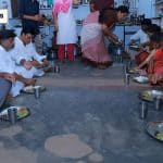 Telangana Chief Minister Revanth Reddy sharing a meal with a rice scheme beneficiary family at their home in Sarapaka village.