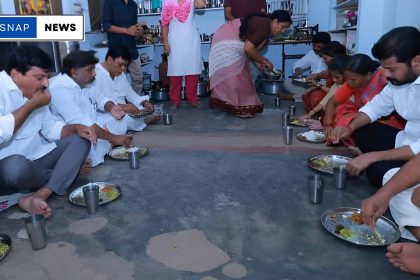 Telangana Chief Minister Revanth Reddy sharing a meal with a rice scheme beneficiary family at their home in Sarapaka village.